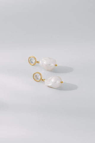 Pair of diamond and pearl earrings with gold accents from One Dame Lane's core bridal collection.